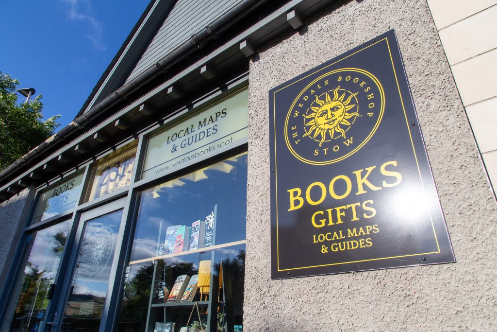 Photograph of the front elevation of The Wedale Bookshop showing a sign stating 'Books, gifts, local maps and guides'